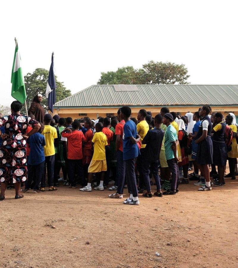 The principal of Government Secondary School, Tudun Wada, announcing the closure of schools to students at the assembly ground following an order by the Nigerian Government to close down schools amid fears of the spreading of the COVID-19 coronavirus in Abuja on March 20, 2020. - Nigeria said on March 19, 2020, it would shut schools and limit religious meetings in its economic hub Lagos and capital Abuja. (Photo by Kola Sulaimon / AFP)